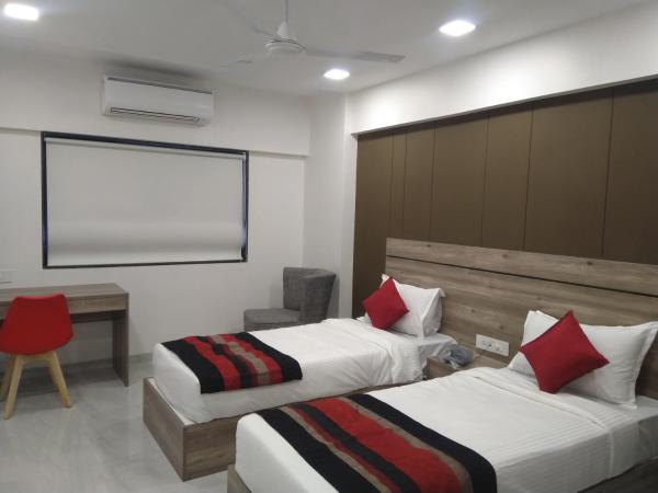 HOTEL INDUS INN : photo 4 de la chambre chambre deluxe double ou lits jumeaux