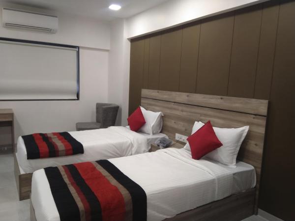 HOTEL INDUS INN : photo 2 de la chambre chambre deluxe double ou lits jumeaux