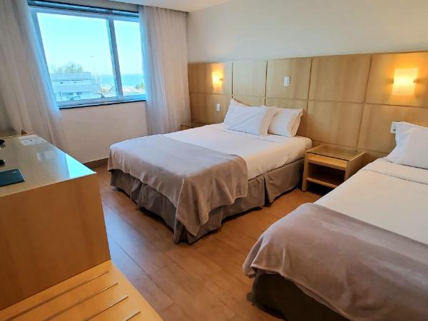 Atlantico Sul Hotel : photo 1 de la chambre triple room with with partial sea view