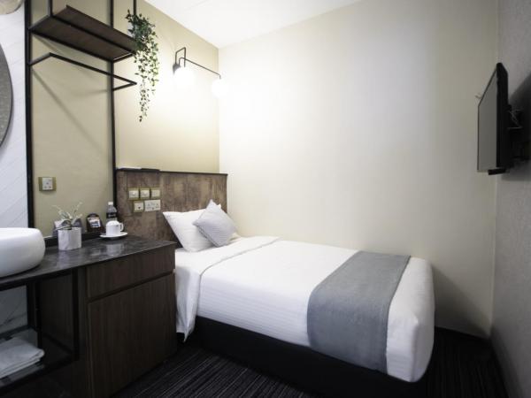 Harbour Ville Hotel - Hamilton : photo 3 de la chambre deluxe single without window