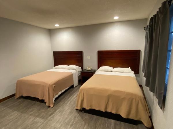 Sandman Motel : photo 2 de la chambre chambre deluxe avec 2 lits queen-size