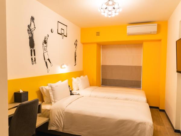 City Inn Macau : photo 1 de la chambre chambre deluxe double ou lits jumeaux
