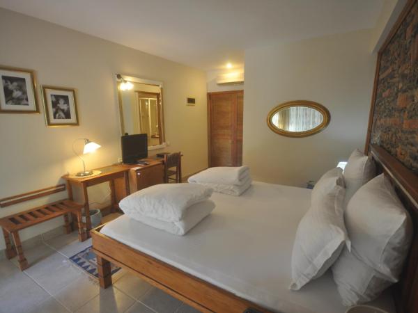El Vino Hotel & Suites : photo 1 de la chambre chambre double ou lits jumeaux standard - vue sur jardin