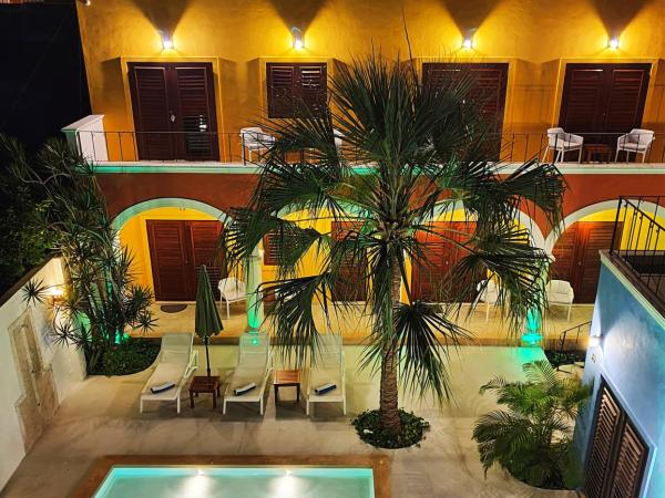Merida Santiago Hotel Boutique : photo 1 de la chambre suite lit king-size - vue sur piscine