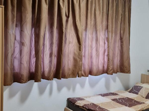 Arató Vendégház : photo 2 de la chambre chambre lits jumeaux avec salle de bains commune