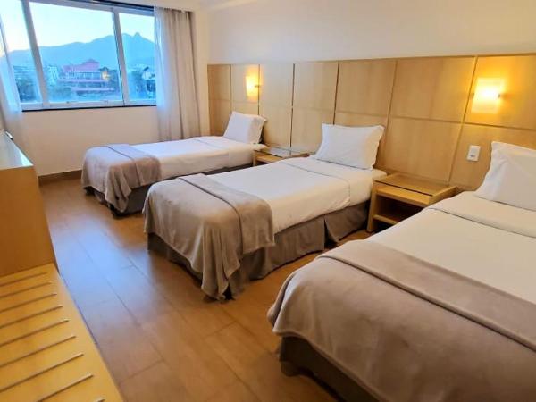 Atlantico Sul Hotel : photo 1 de la chambre chambre triple - vue sur ville