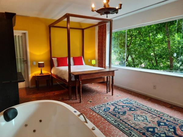 Rio Boutique Suites : photo 1 de la chambre suite deluxe avec baignoire spa