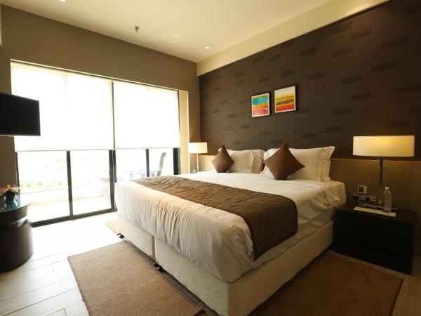Wyndham Ahmedabad Shela : photo 2 de la chambre deluxe room, 1 king or 1 twin bed, city or garden view, non-smoking