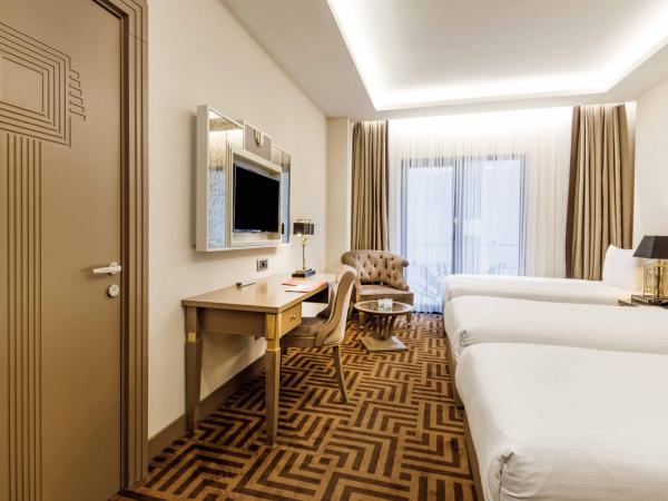 Ramada by Wyndham Istanbul Golden Horn : photo 2 de la chambre chambre triple avec 3 lits simples