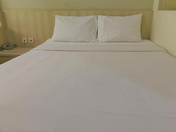 LeGreen Suite Penjernihan : photo 5 de la chambre chambre double ou lits jumeaux standard