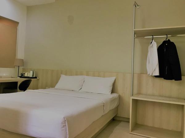 LeGreen Suite Penjernihan : photo 9 de la chambre chambre double ou lits jumeaux supérieure