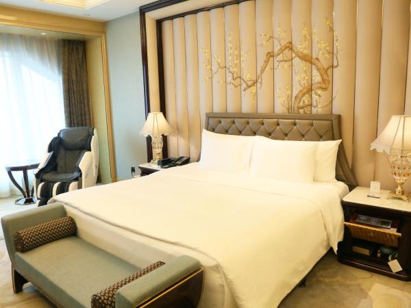 Wanda Reign Wuhan : photo 4 de la chambre chambre lit king-size exécutive