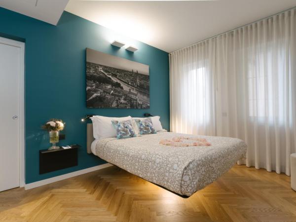 Hotel Giulietta e Romeo ***S : photo 2 de la chambre suite 2 chambres avec terrasse - bâtiment séparé