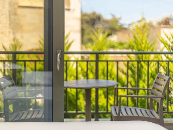 Anna Maria Village : photo 3 de la chambre chambre supérieure - vue sur jardin