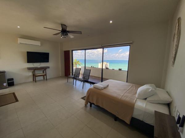 Cuxos Hotel Beachfront : photo 1 de la chambre chambre quadruple - vue sur mer