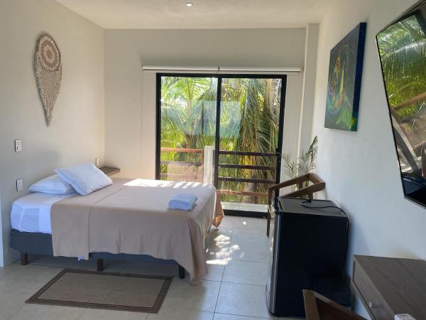 Cuxos Hotel Beachfront : photo 6 de la chambre chambre quadruple - vue sur mer