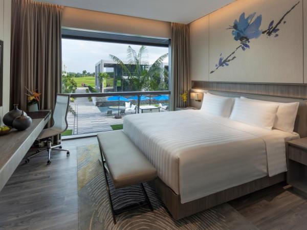 Dusit Thani Laguna Singapore : photo 1 de la chambre hébergement lit king-size deluxe laguna - vue sur piscine