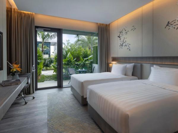 Dusit Thani Laguna Singapore : photo 1 de la chambre hébergement lits jumeaux deluxe laguna avec terrasse - vue sur piscine