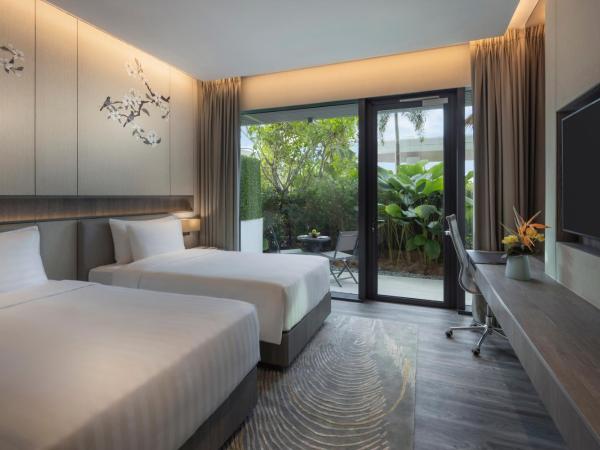 Dusit Thani Laguna Singapore : photo 1 de la chambre hébergement lits jumeaux deluxe laguna avec terrasse - côté ville