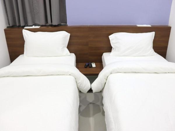 Sharman Suites : photo 1 de la chambre chambre lits jumeaux standard