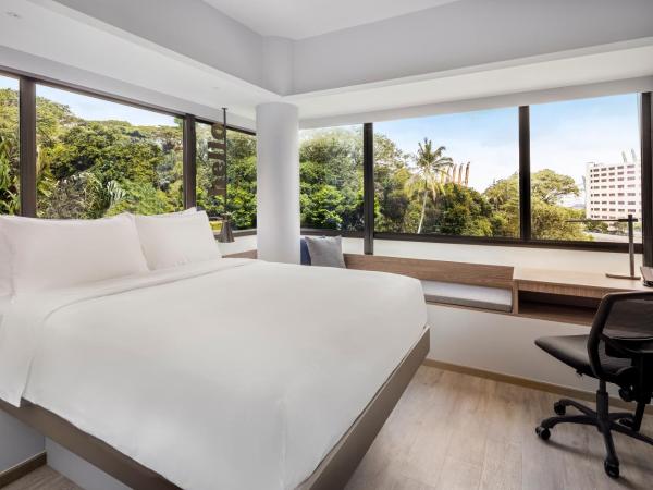 Travelodge Harbourfront Singapore : photo 2 de la chambre hébergement lit queen-size deluxe plus