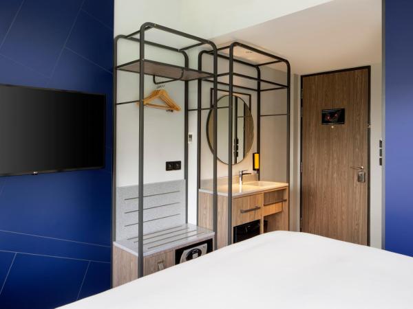 Travelodge Harbourfront Singapore : photo 5 de la chambre hébergement lit queen-size deluxe plus