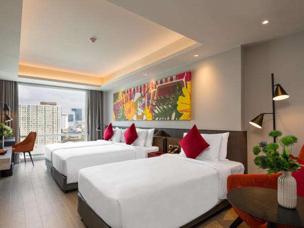 Maitria Hotel Rama 9 Bangkok - A Chatrium Collection : photo 1 de la chambre hébergement triple premier - vue sur jardin