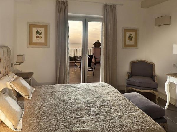 Tenuta Del Poggio Antico : photo 7 de la chambre chambre double deluxe avec balcon - vue sur mer