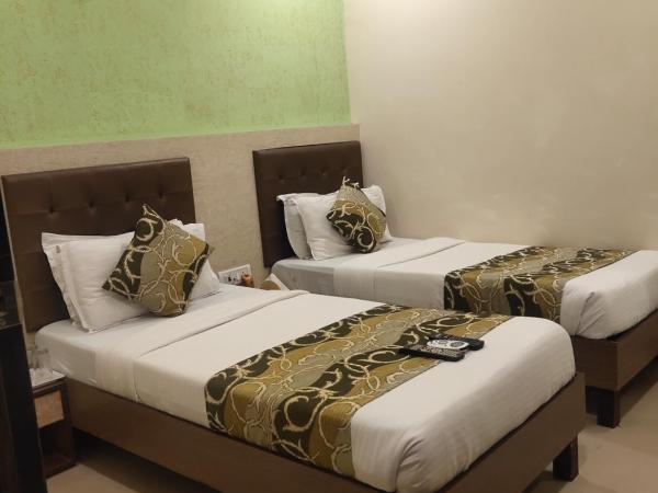 Hotel Golden Nest Popular Residency : photo 2 de la chambre chambre lits jumeaux deluxe