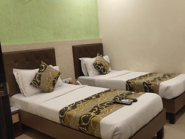 Hotel Golden Nest Popular Residency : photo 3 de la chambre chambre lits jumeaux deluxe