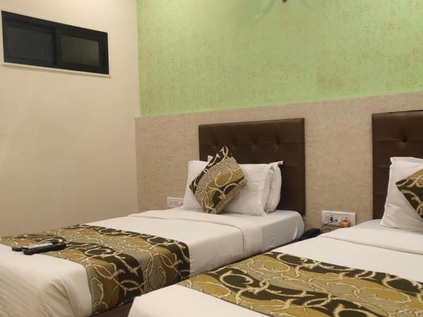 Hotel Golden Nest Popular Residency : photo 4 de la chambre chambre lits jumeaux deluxe