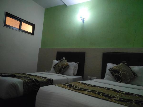 Hotel Golden Nest Popular Residency : photo 5 de la chambre chambre lits jumeaux deluxe