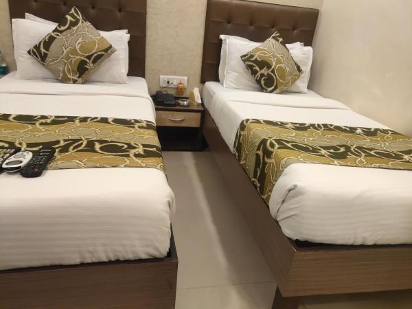 Hotel Golden Nest Popular Residency : photo 6 de la chambre chambre lits jumeaux deluxe