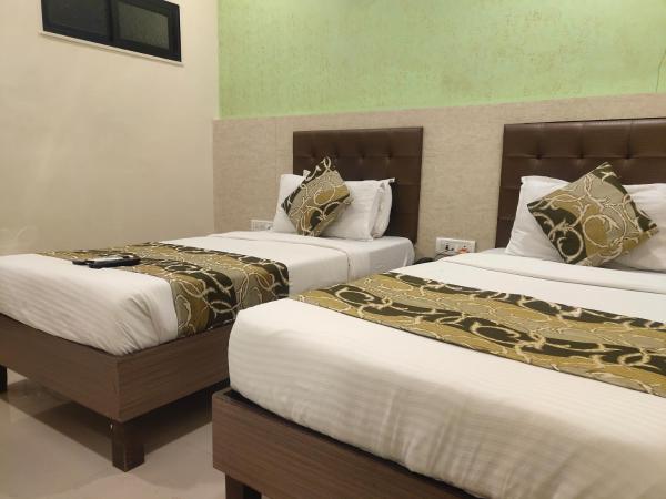 Hotel Golden Nest Popular Residency : photo 8 de la chambre chambre lits jumeaux deluxe