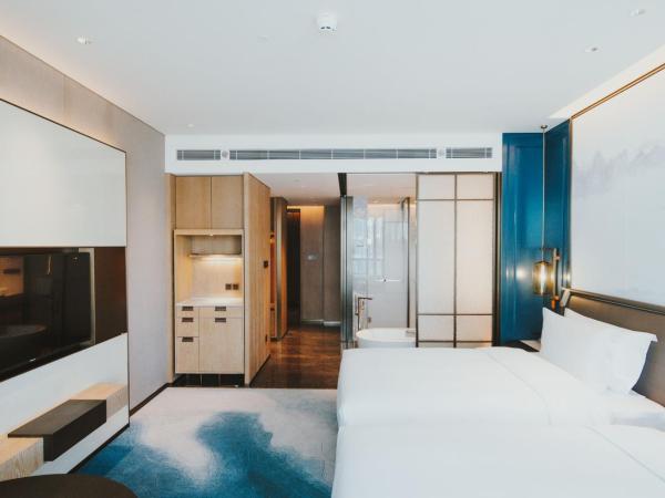 青岛海天大酒店 : photo 1 de la chambre chambre lits jumeaux supérieure - vue sur mer