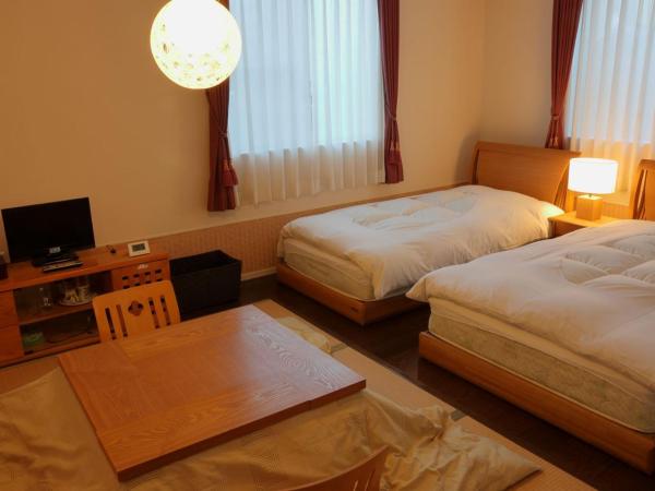 RokuRoku : photo 3 de la chambre chambre lits jumeaux avec salle de bains