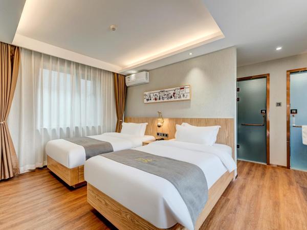 Happy Dragon City Culture Hotel -In the city center with ticket service&food recommendation,Near Tian'AnMen Forbidden City,Wangfujing walking street,easy to get any tour sights in Beijing : photo 2 de la chambre suite familiale