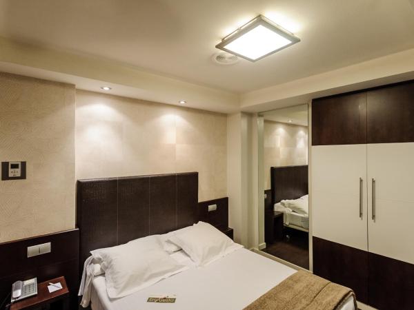 Hotel Alda San Carlos : photo 6 de la chambre grande chambre simple