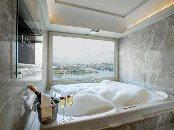 Lazzoni Hotel : photo 1 de la chambre suite junior lifestyle avec baignoire spa