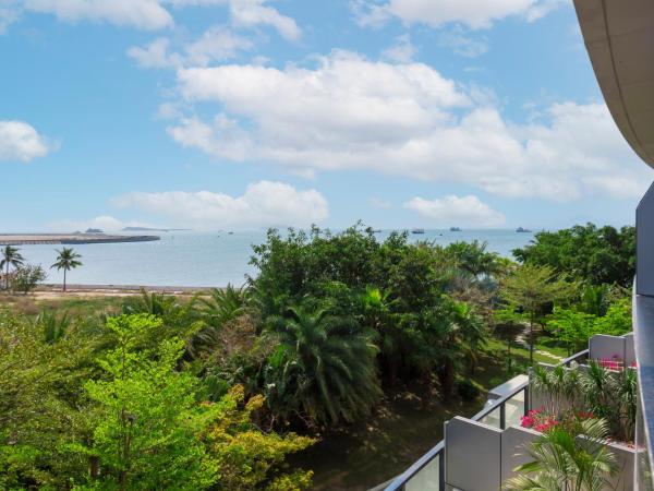 Sanya Phoenix Island Yuejia flat : photo 3 de la chambre chambre lit king-size - vue sur mer