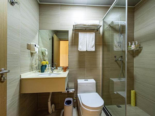 Shanghai JOYFUL YARD Hotel-Free shuttle bus from Pudong Airport and Disneylan : photo 3 de la chambre chambre lits jumeaux deluxe