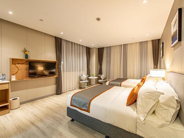 Shanghai JOYFUL YARD Hotel-Free shuttle bus from Pudong Airport and Disneylan : photo 3 de la chambre chambre familiale