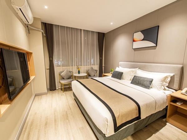 Shanghai JOYFUL YARD Hotel-Free shuttle bus from Pudong Airport and Disneylan : photo 3 de la chambre chambre lit queen-size deluxe
