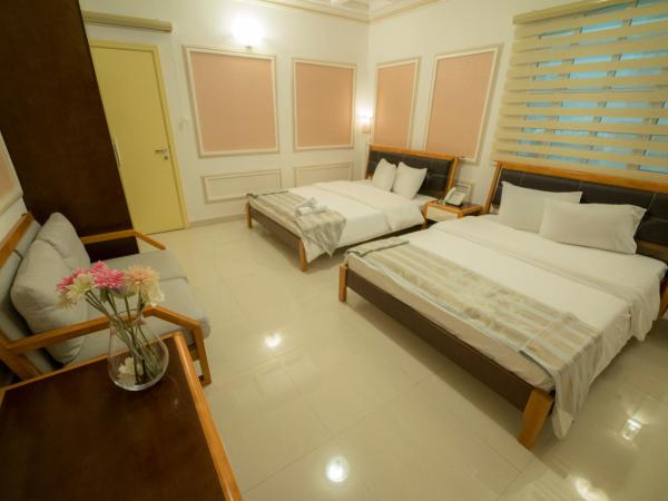 Al Ghubrah Plaza Hotel : photo 2 de la chambre chambre familiale deluxe