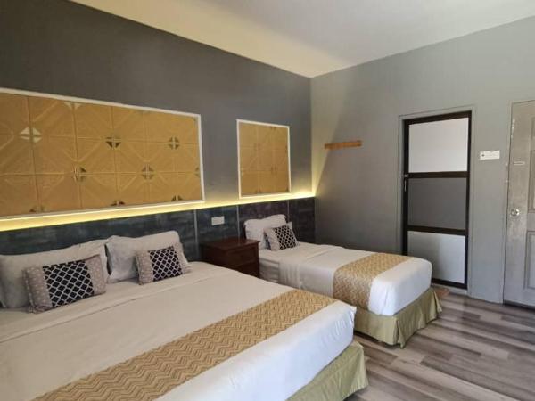 Tc theme park Guest house : photo 1 de la chambre chambre lits jumeaux avec balcon