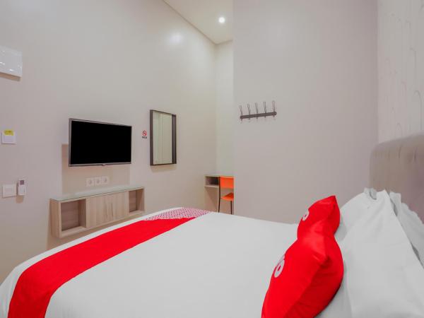 Super OYO Capital O 90336 Olive Guest House : photo 4 de la chambre chambre double deluxe