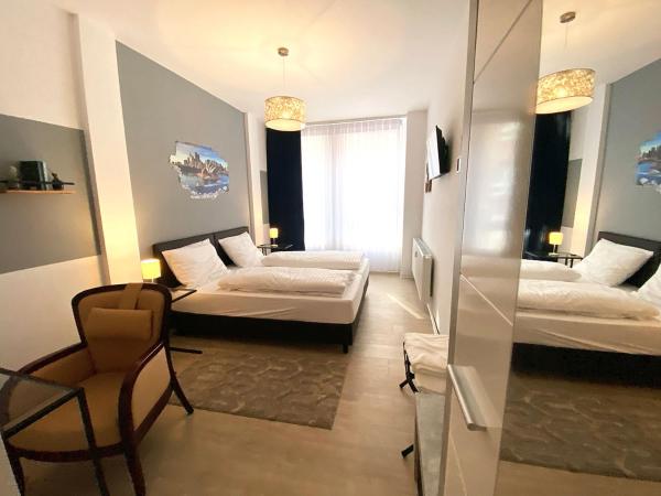 Kangarooms - Schlachte Weserpromenade : photo 1 de la chambre chambre double avec lit d'appoint