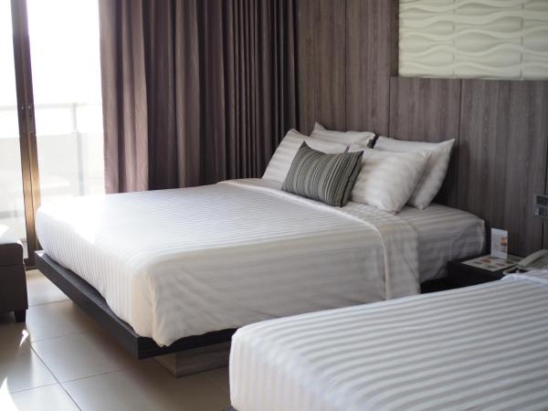 Hermann Hotel Pattaya - SHA Extra Plus : photo 1 de la chambre chambre triple - vue sur ville