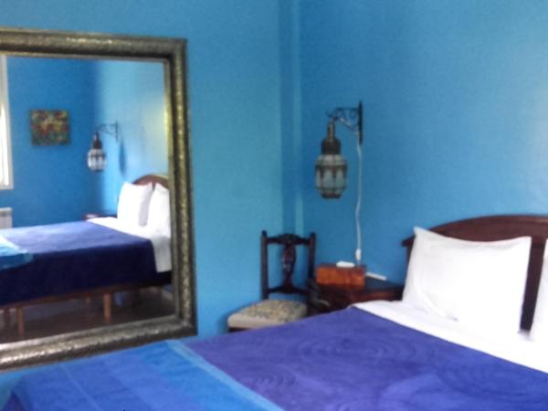 Riad TANJIL : photo 2 de la chambre chambre lit queen-size - vue sur jardin