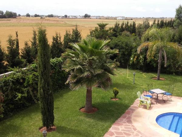 Riad TANJIL : photo 5 de la chambre chambre double ou lits jumeaux - vue sur piscine
